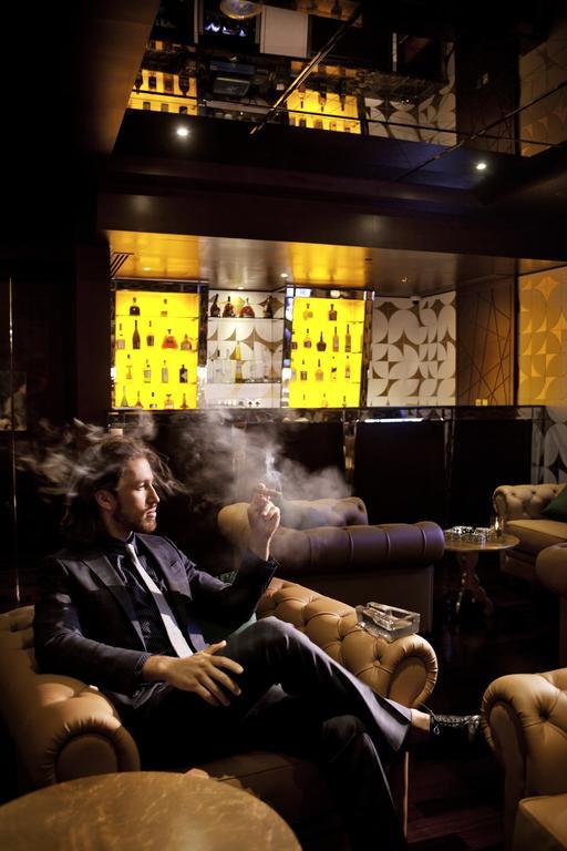 The Domain Bahrain Hotel And Spa - Adults Friendly 16 Years Plus Манама Екстер'єр фото A man smoking in a nightclub